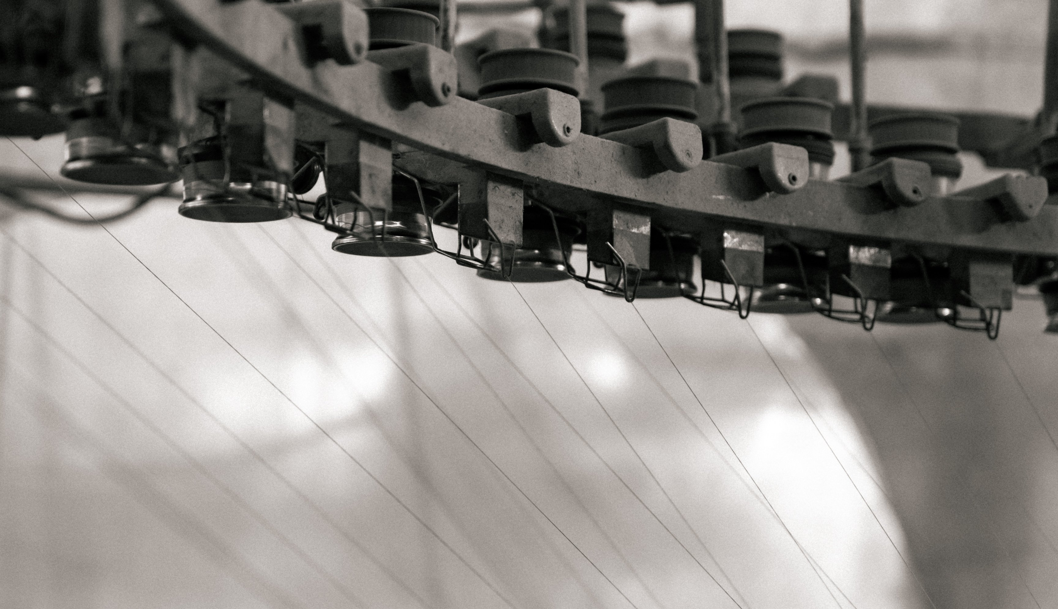 Overhead garment conveyor rail in black and white