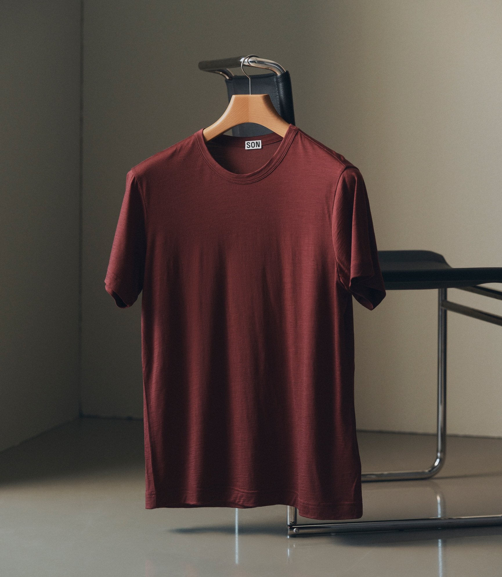 Burgundy T-Shirt on a wooden hanger