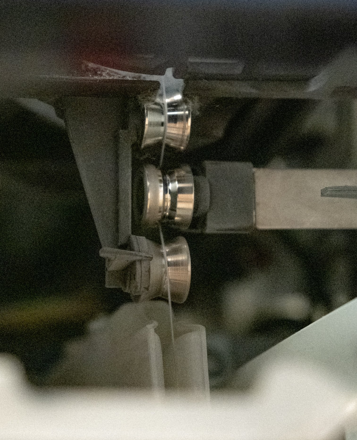 Close-up of yarn winding machinery