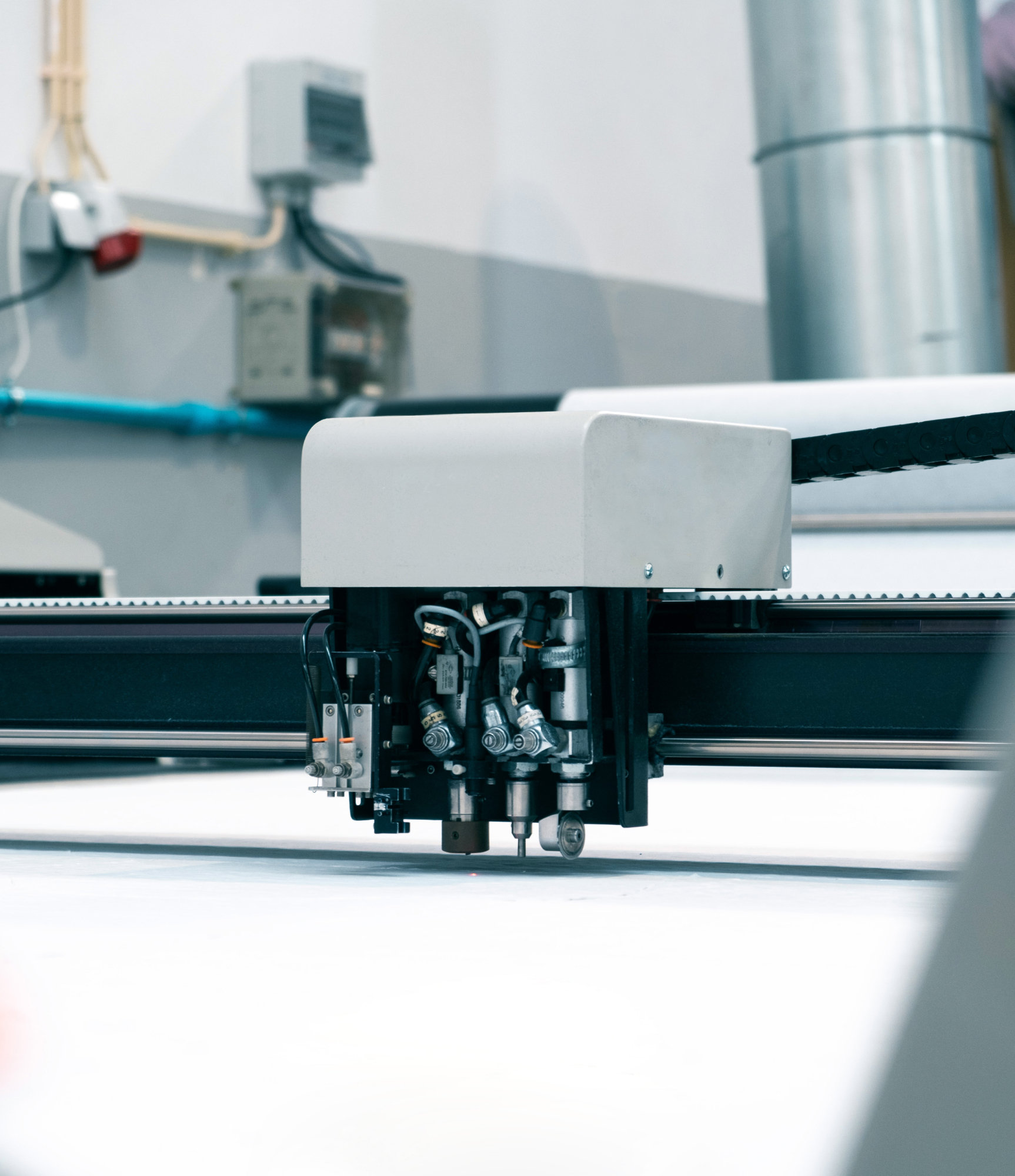 Close-up of a fabric-cutting machine in SON Supply