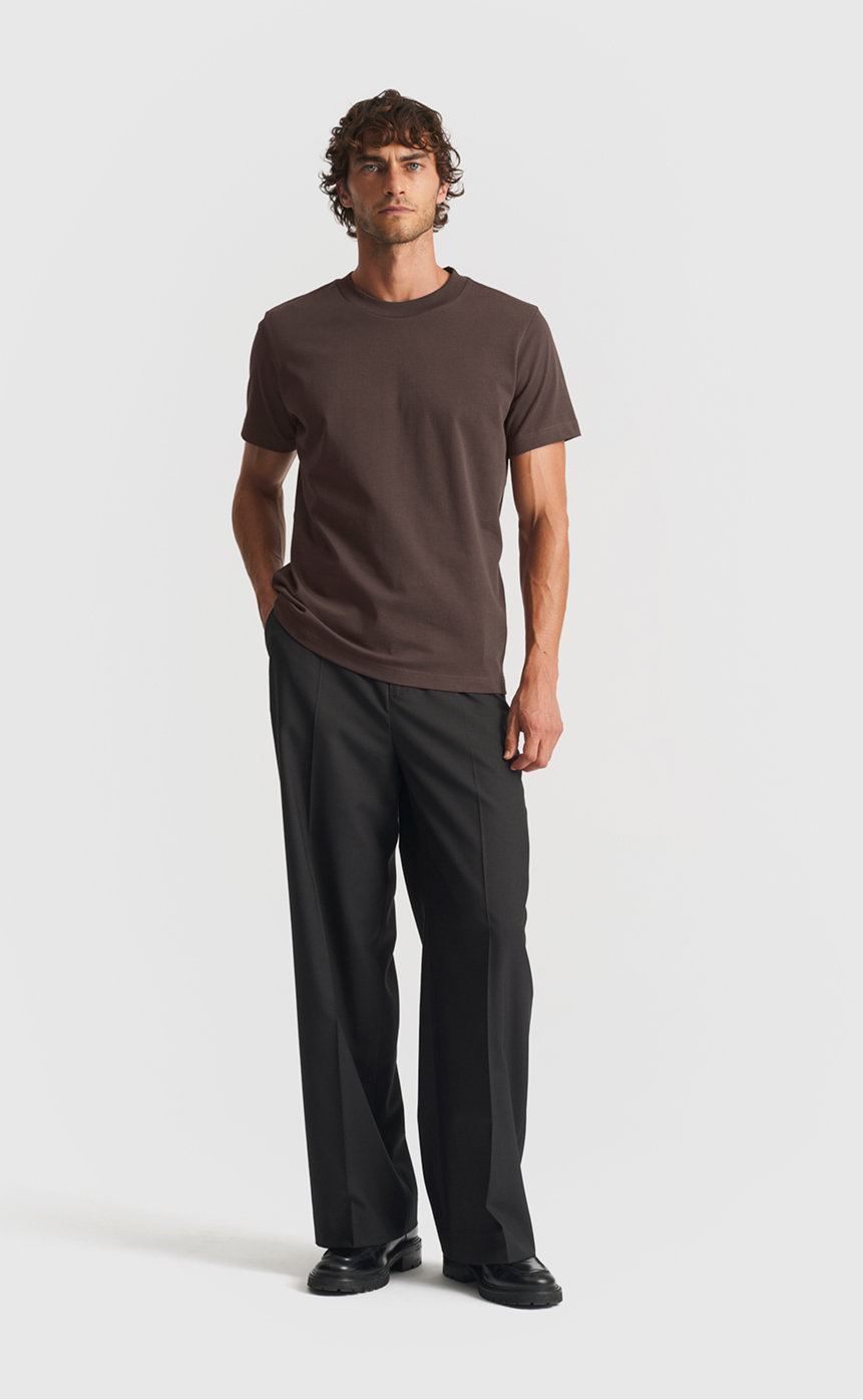 Model wearing our extra heavy cotton t-shirt in seal brown