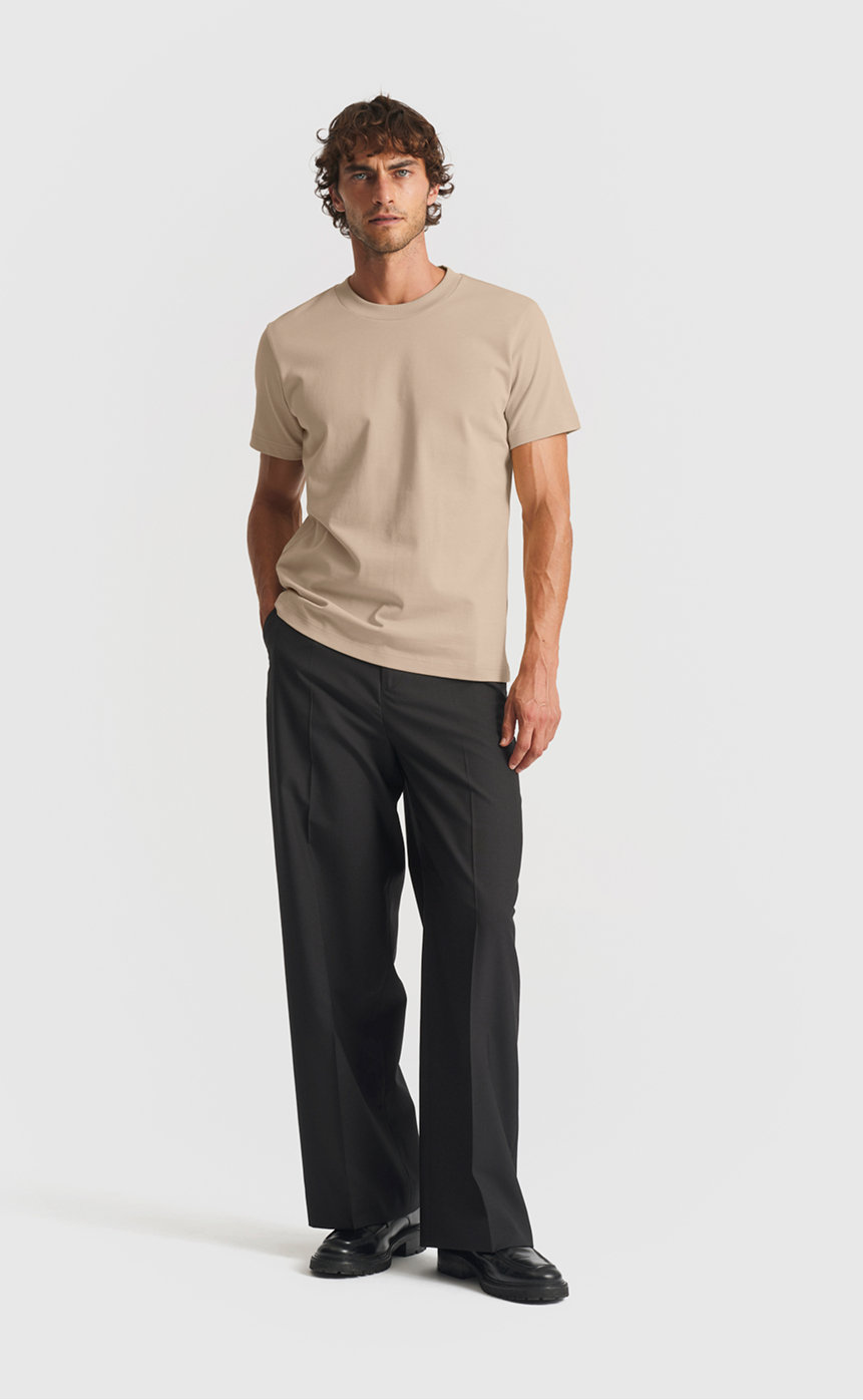 Model wearing our extra heavy cotton t-shirt in plaza taupe