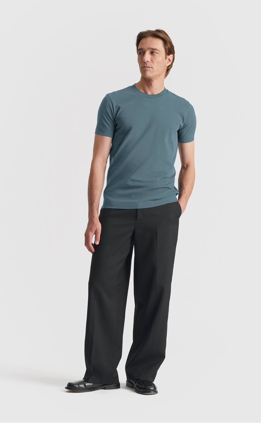 Model wearing our extra heavy cotton t-shirt in dark slate