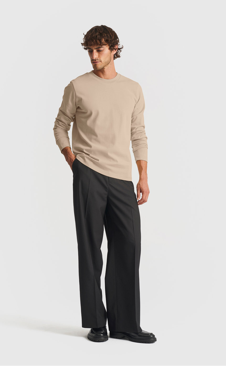 Model wearing our extra heavy long sleeve cotton t-shirt in plaza taupe