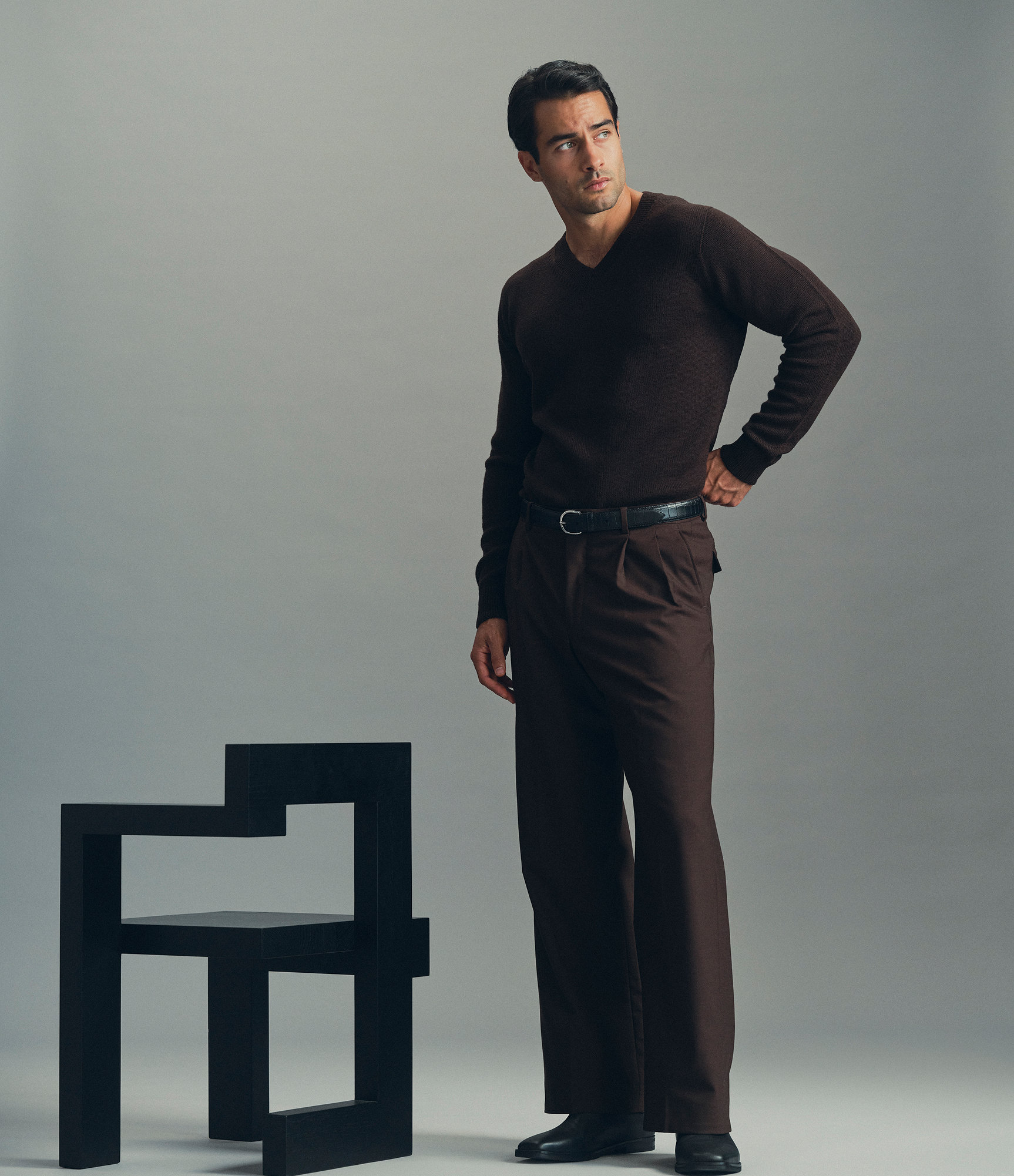 Model wearing our merino v-neck sweater in night brown