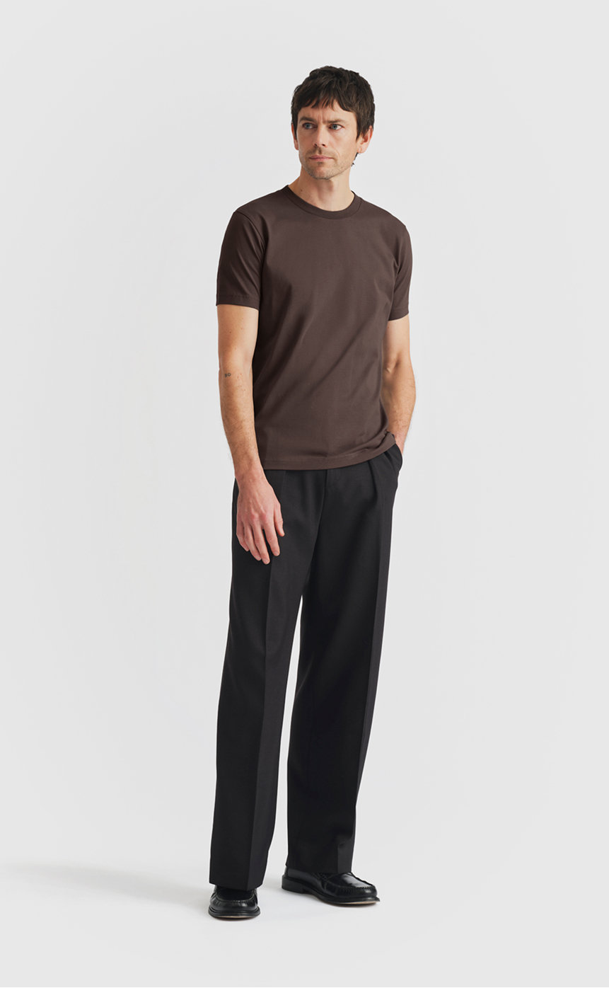 Model wearing our cotton t-shirt in seal brown