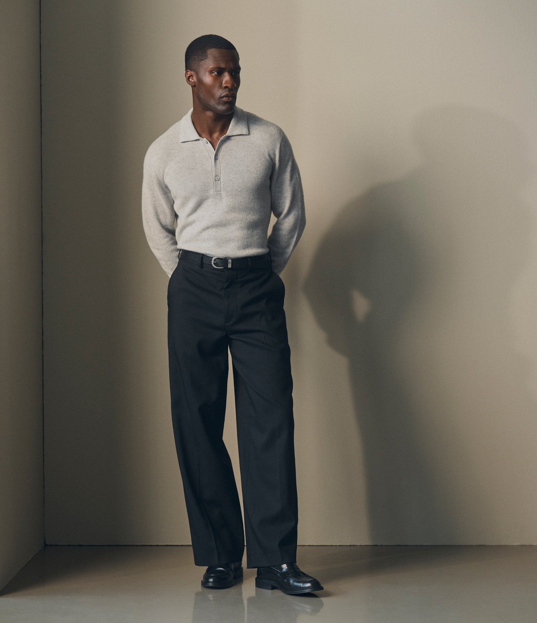 Model wearing our cashmere polo shirt in light grey