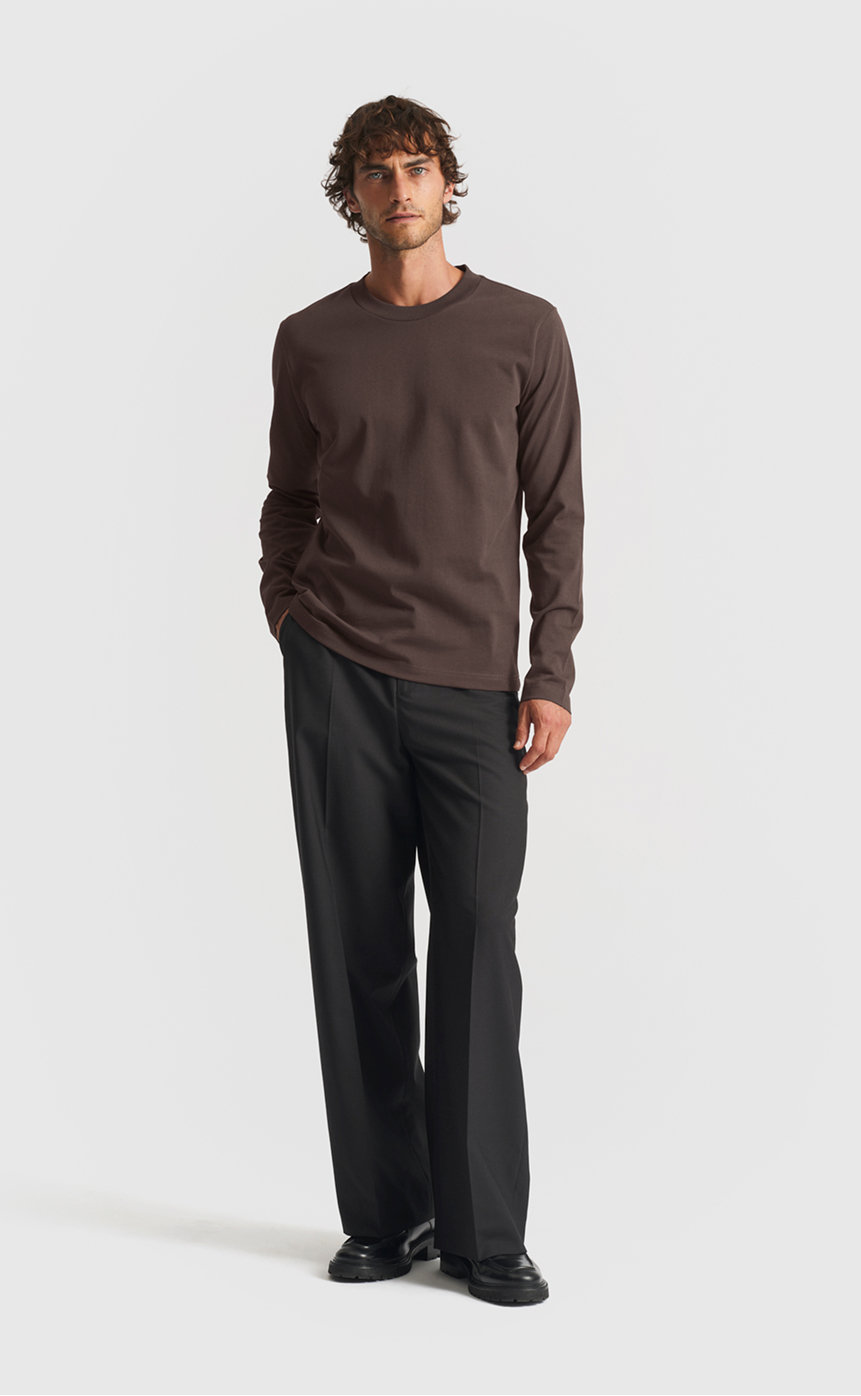 Model wearing our extra heavy long sleeve cotton t-shirt in seal brown