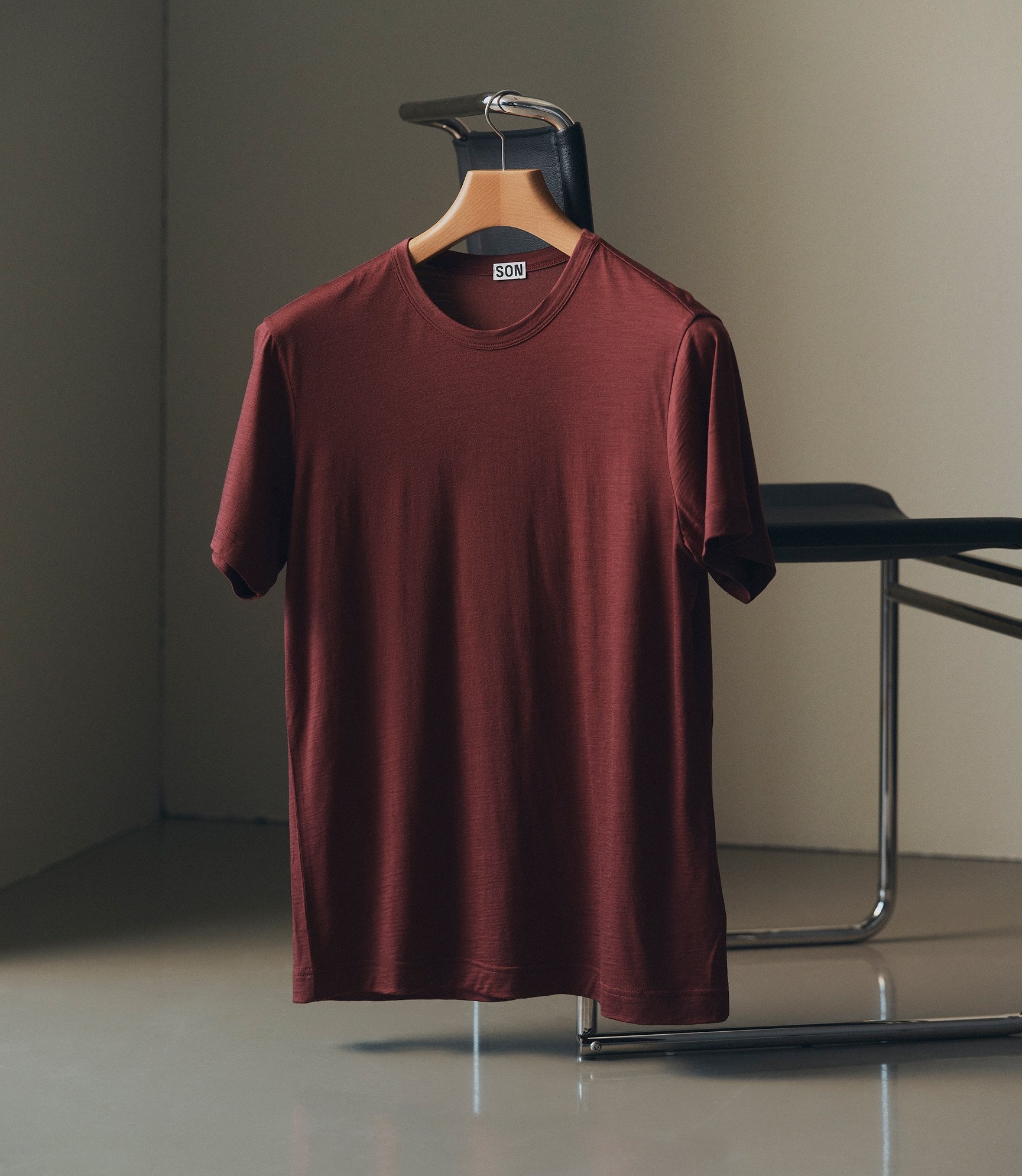 Wool t-shirt in andorra hanging from a chair