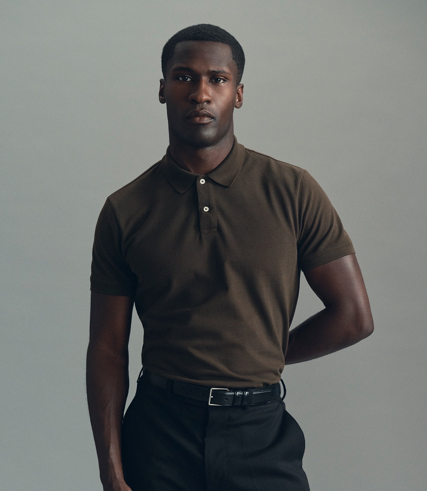 Model wearing our pique polo shirt in demitasse