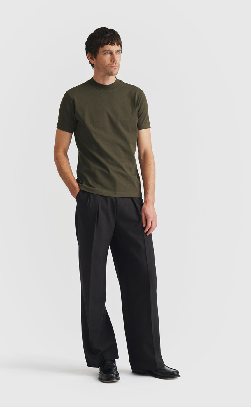 Model wearing extra heavy cotton hi-neck t-shirt in grape leaf