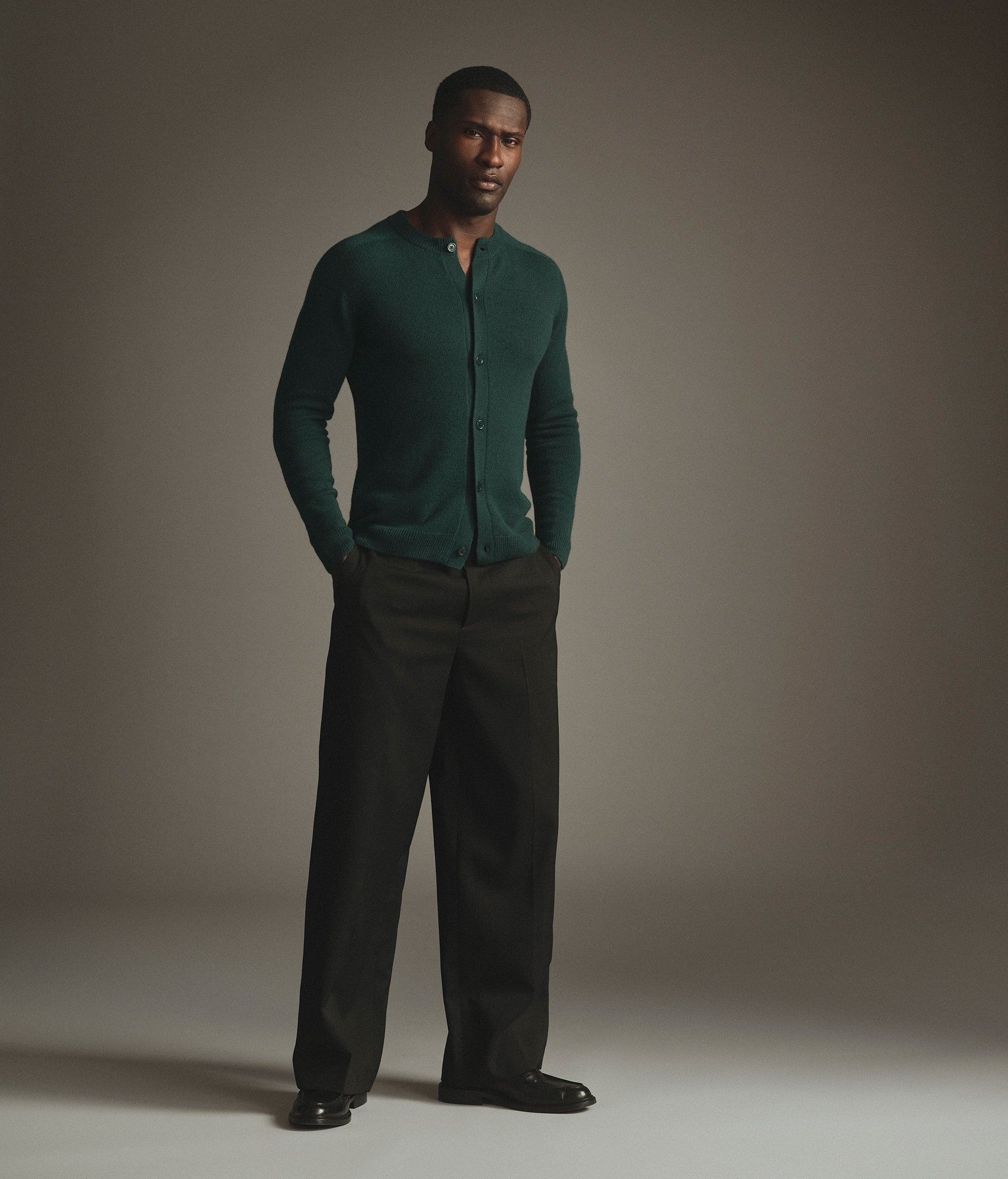 Model wearing our cashmere button up sweater in Malachite
