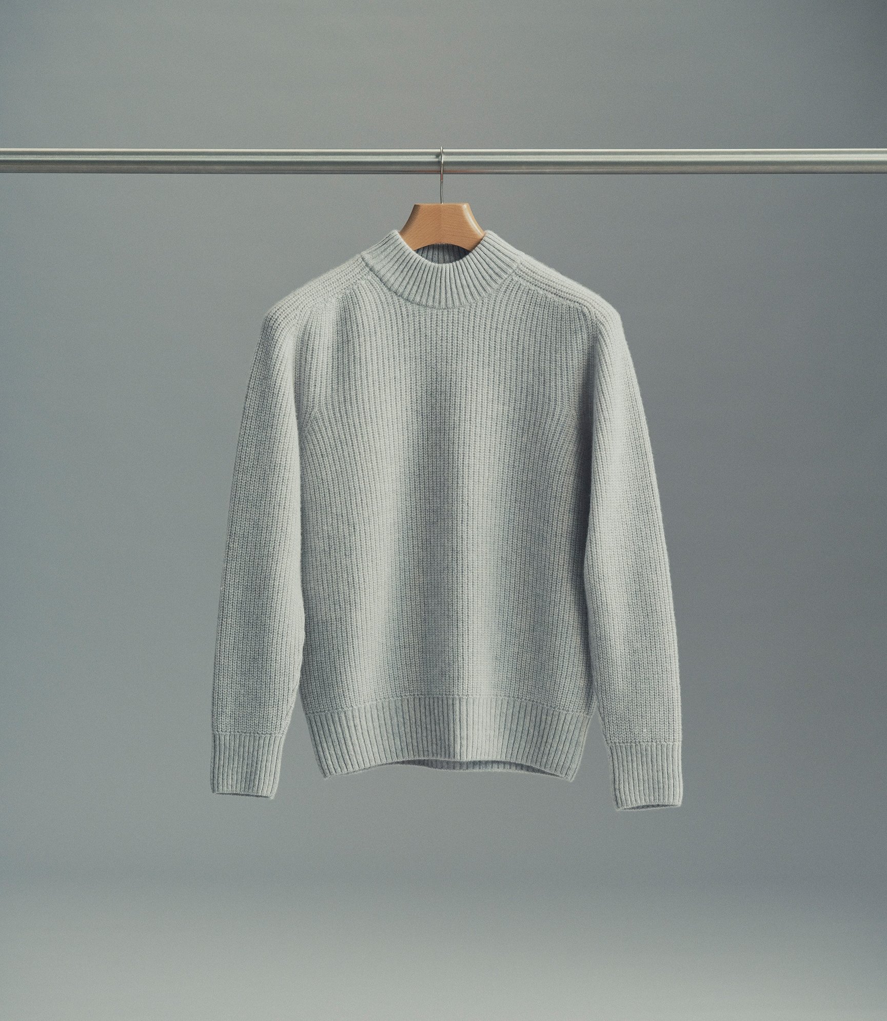Model wearing our Cashmere Hi-Neck Sweater in Light Grey Melange