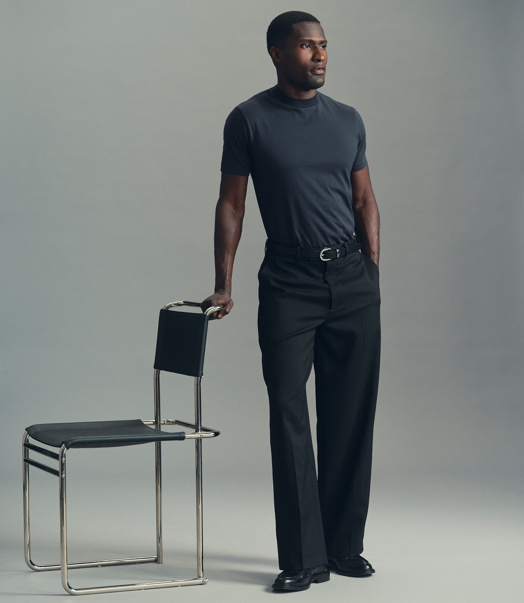 Model wearing our cotton hi-neck t-shirt in deep blue
